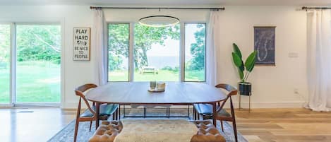 Large open dining/living to gather for dinners, games and puzzles!