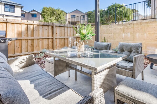 Enjoy fresh coastal breezes as you dine on the private patio, perfect for sunset BBQs.