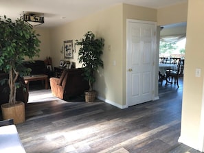 Living room, door to downstairs and dining area on middle level