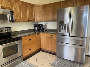 Newer appliances and lots of Corian counter top space.