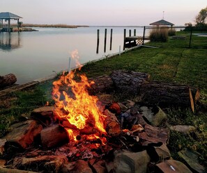 Enjoy a sunset over a fire on the bay! (BYO firewood)