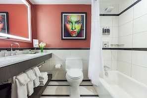 Bathroom with shower and tub. Basic toiletries and towels are provided