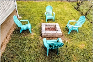 Fire pit and 4 Adirondack chairs provided 