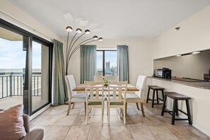 This bright and sunny room allows everyone to enjoy a meal together.