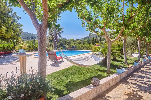 Swimming pool and hammock at Villa Can Domingo, Alaro, Mallorca