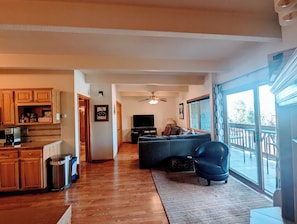 living area, balcony and end of kitchen from workstation 