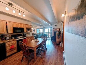 kitchen, workstation, fireplace, balcony, living area edge