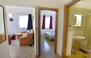 Access to the living area, bedroom and bathroom.