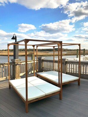 Relax on our day bed with unobstructed views of the water
