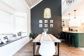 Dining table seating up to 6 ppl plus extra seating at the breakfast bar.