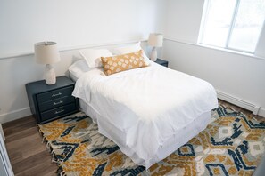 Bedroom 1 features a queen size bed.