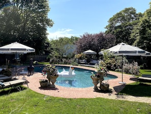 Outdoor pool area and lounge chairs