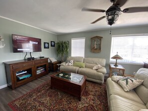 Living area with leather sofas that recline 