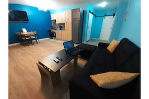 Living, Dining and Kitchen area.