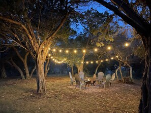 Turn on the outdoor lighting for a magical touch at night around the fire pit, or turn them off for some prime stargazing!