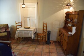Antique dining table with ladder back chairs