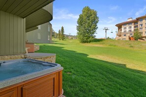 The private hot tub is located on the lowest level of the townhome, directly on the ski hill.