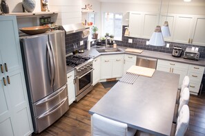 Fully stocked kitchen with microwave built into the island.