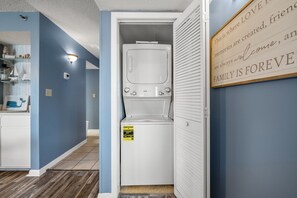 The washer and dryer are inside the closet.