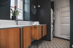 Large bathroom on the first floor with washer and dryer