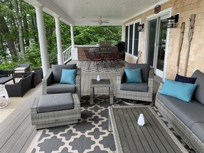 Covered porch, with grill, fridge, comfortable seating and dining on Lake side.