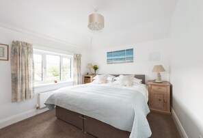 Apple Blossom, near Bridport: Bedroom one with super-king size zip and link bed