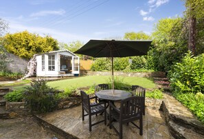 Apple Blossom, Bridport: The garden terrace with shaded seating