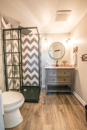 Master en-suite bathroom with beautiful rain shower- first floor location.