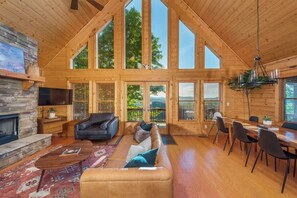 Open concept living and dining with mountain views