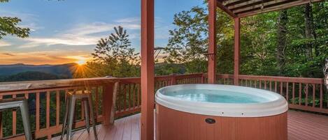 Relax in the hot tub with gorgeous mountain views