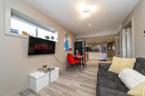 The living room features a smart tv complete with complimentary Netflix.