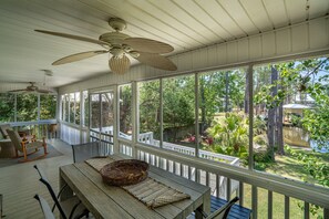 Screened in porch overlooking the water