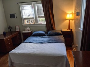 Downstairs bedroom with one queen bed