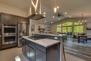 Kitchen area with stainless-steel appliances and large island