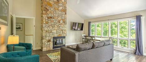 Upper level living area, dining area, and electric fireplace