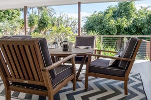 Small sitting area on the deck overlooking the backyard.