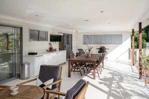 Large covered deck entertainment area.