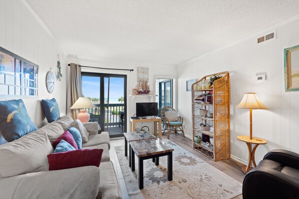 The ocean front living room is well-appointed with comfortable furnishings.