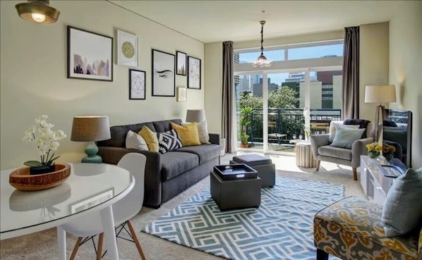 Bright living room with comfortable sofa bed. 