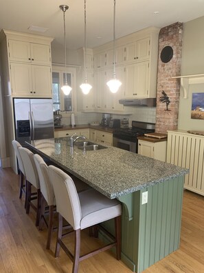 View of the kitchen as you enter the house from the side entrance.