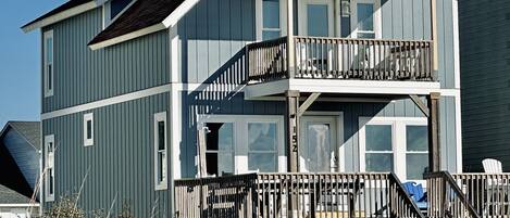 Expansive Deck Space with outdoor shower/hose area