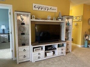 Living room with 60inch smart tv and Nintendo game system