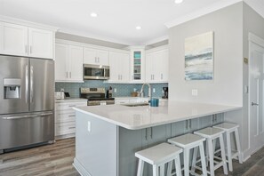 Large open kitchen with bar seating