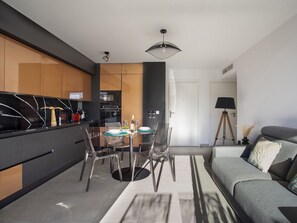 Furniture, Interior Design, Flooring, Kitchen, Wood, Floor, Ceiling, Countertop, Room, Chair