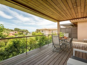 Plant, Building, Sky, Property, Furniture, Cloud, Wood, Porch, Shade, Chair