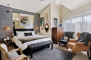 Retreat to the tranquil primary bedroom, furnished with a plush king bed, ensuring restful nights and serene mornings.