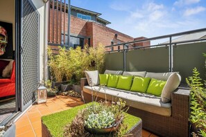 Soak up the sun on the private balcony, furnished with seating and perfect for relaxing with a morning coffee or evening drink.

