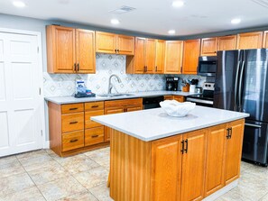 Come on in and enter into the open format kitchen. fully-equipped kitchen where you can cook in.