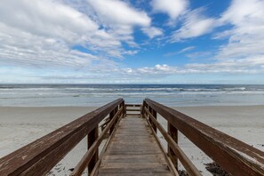 Walkway to beach.  Packed white sand perfect for running, biking, or walking.