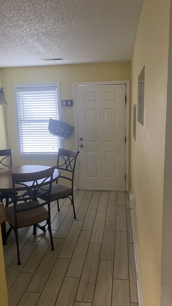 Main door enters into the dining room. There is a cooler bag there for use 